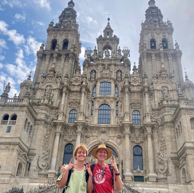 Sam and Andrew McCarthy pose in front of Santiago de Compostela Cathedral in Galicia, Spain, at the end of their 500-mile pilgrimage chronicled in the book "Walking with Sam." (Photo courtesy of Andrew McCarthy)